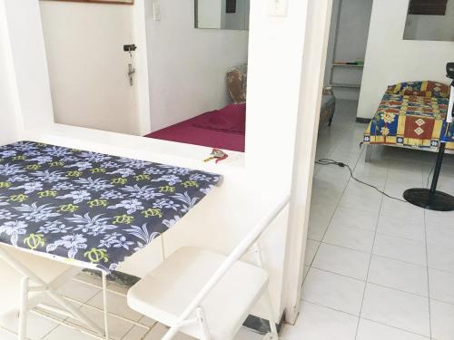 a small room with a table and a bed at African Symbol Guest House in Montego Bay