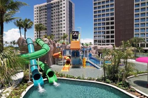 a water park with a water slide in a city at Salinas Premium Resort in Salinópolis