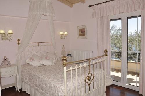 Postel nebo postele na pokoji v ubytování Villa Romantica