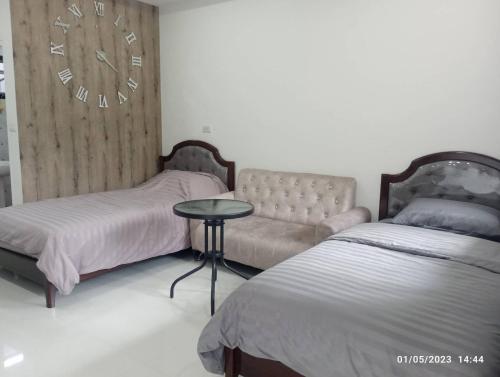 Säng eller sängar i ett rum på Plern Ping เพลินพิง