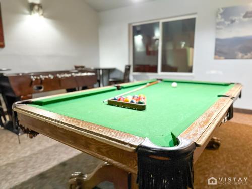 a pool table in a room with afits at Luxury Ski Condo With Hot Tub in Brian Head
