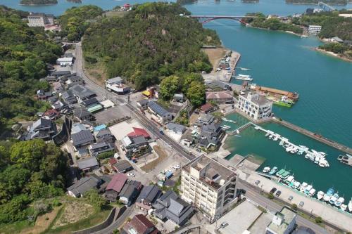 an aerial view of a harbor with boats in the water at お宿misora 合津港近く松島の自然と海を満喫できる平屋の貸切別荘 in Kami Amakusa