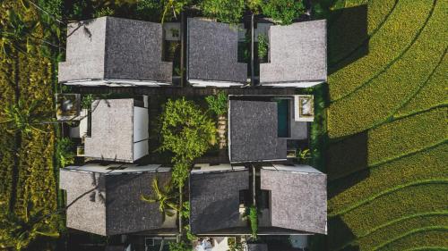 an overhead view of a building with trees on it at The Saren in Tanah Lot