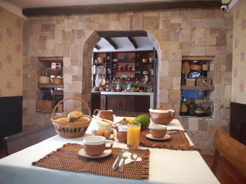 a kitchen with a table with food on it at Casona Del Rosario - Plaza de Armas in Chachapoyas