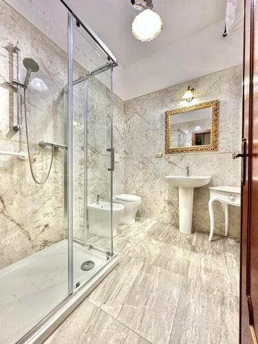 a bathroom with a shower and a sink at PENSIONE ITALIA in Bolsena