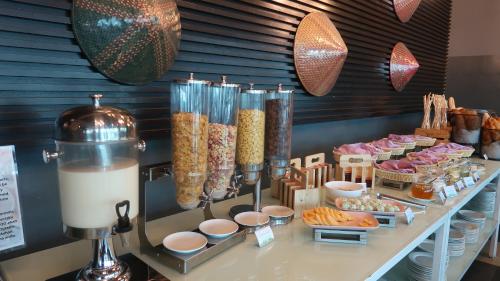 a buffet of food on a table in a restaurant at Wyndham Garden i-City Shah Alam in Shah Alam