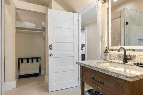 a bathroom with a sink and a mirror at Waterfront Inn in Gig Harbor