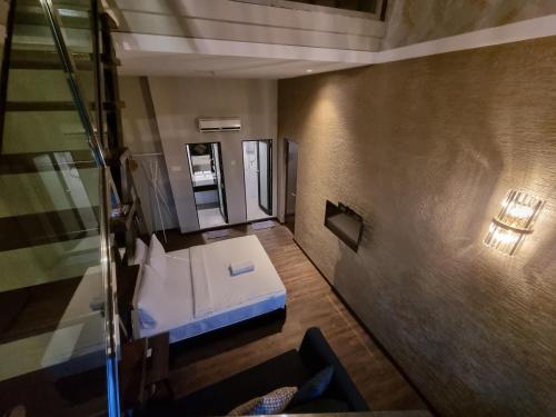 Ένα ή περισσότερα κρεβάτια σε δωμάτιο στο MIICO Hotel @ Mount Austin