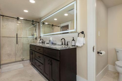 a bathroom with a sink and a shower at Waterfront Inn in Gig Harbor