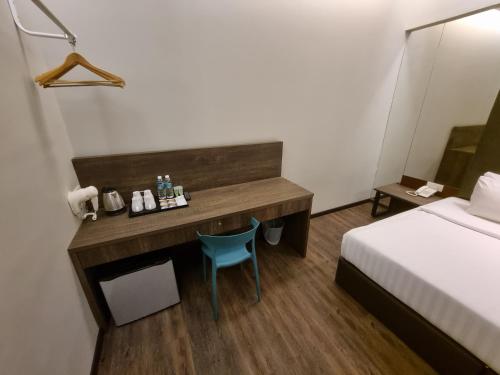 Ένα ή περισσότερα κρεβάτια σε δωμάτιο στο MIICO Hotel @ Mount Austin