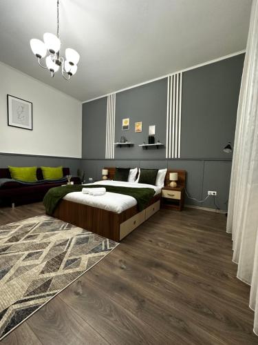 a bedroom with a bed and a couch at Borkum in Sibiu