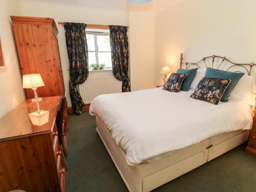 Postel nebo postele na pokoji v ubytování Forge Cottage