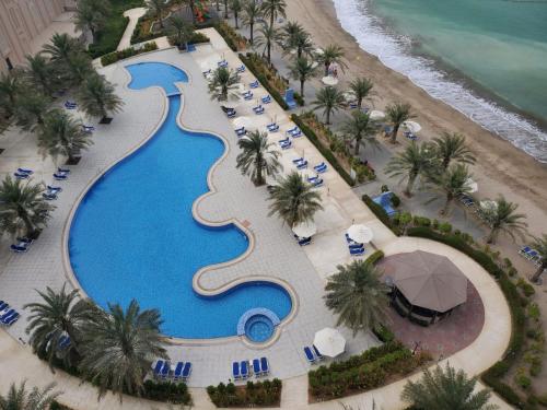 an overhead view of a swimming pool at a resort at Al Bahar Hotel & Resort in Fujairah