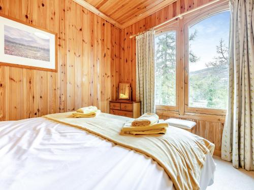 Ένα ή περισσότερα κρεβάτια σε δωμάτιο στο Stuffers Cottage