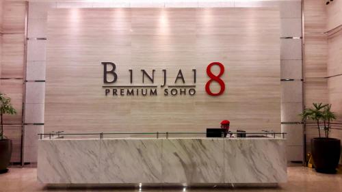 a sign for a bimiami algorithm store in a mall at Binjai 8 KLCC by PSM Luxury Suites in Kuala Lumpur