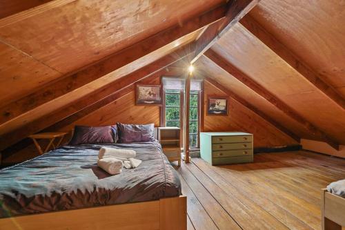 a bedroom with a large bed in a attic at Blerick Country Retreat in Neerim South