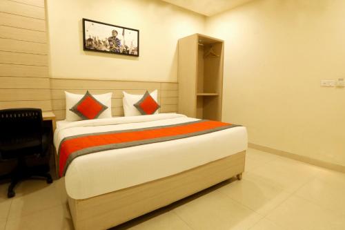 a bedroom with a large bed in a room at Perfect Plus just 5 mins walk to Golden Temple in Amritsar