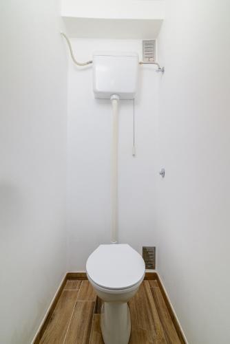 a bathroom with a white toilet in a room at Apartment Premantura 2228a in Premantura