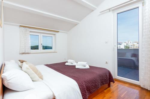 Postel nebo postele na pokoji v ubytování Apartment Medulin 2274a