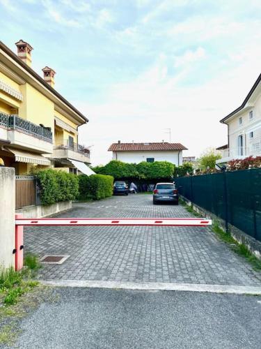 a car parked in a parking lot next to a building at Dimora del Viaggiatore in Marina di Carrara