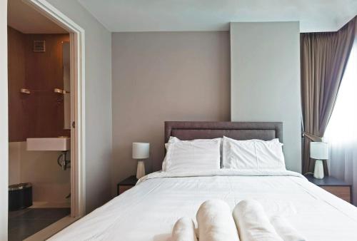 Katil atau katil-katil dalam bilik di Blossom Sathorn Hospitality （曼谷高端酒店公寓）