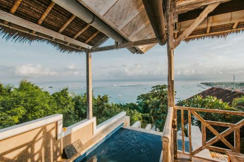 a view of a swimming pool from a house at Villa Lanie Lembongan in Nusa Lembongan