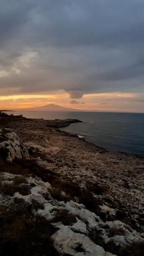 a view of the ocean from a rocky beach at I MORI G&G in Augusta