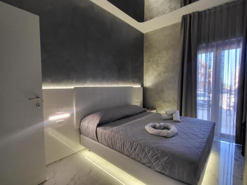 Ένα ή περισσότερα κρεβάτια σε δωμάτιο στο B&B Luxury Room & SPA