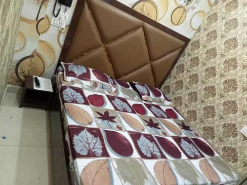 a bed in a box in a room at Hotel Sunshine in Ludhiana