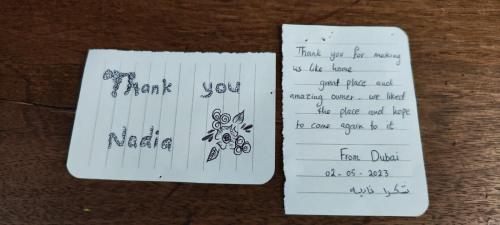 two pieces of paper with writing on them at B&B La Casa Gialla Di Luca in Mazzè