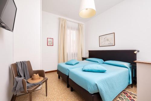 Katil atau katil-katil dalam bilik di Residence Ca' Foscolo