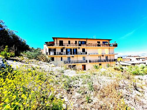 a building on the side of a hill at Appartamento Castel Sant'Angelo in Licata