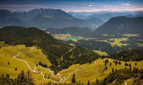 a view of a valley in the mountains with trees at Biolandhaus Seethaler in Vorderthiersee