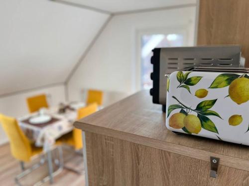 a printer on top of a counter with a room at Ferienwohnung Viktring 4-5 Pers. in Klagenfurt