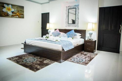מיטה או מיטות בחדר ב-Island Charm of Praslin