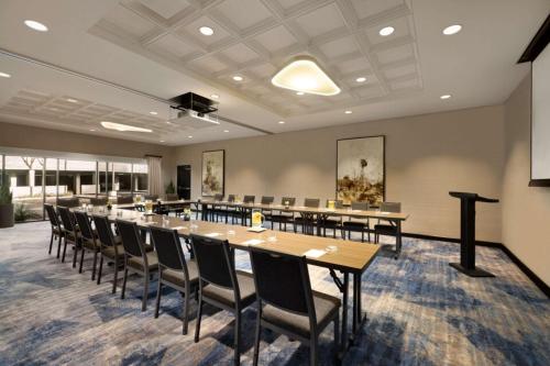 a large conference room with a long table and chairs at Hyatt Centric Santa Clara Silicon Valley in Santa Clara