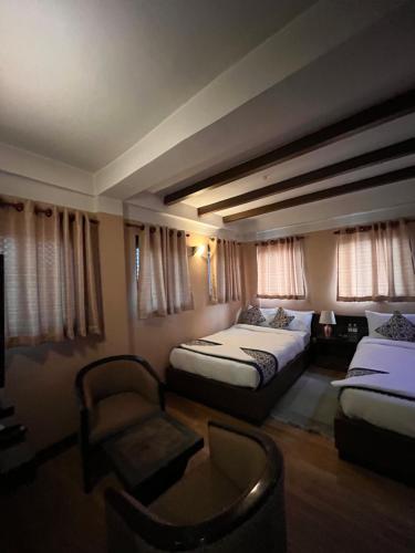 Postel nebo postele na pokoji v ubytování Hotel Garuda