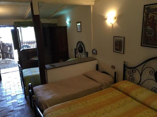 Cama o camas de una habitación en Agriturismo Monte Due Torri