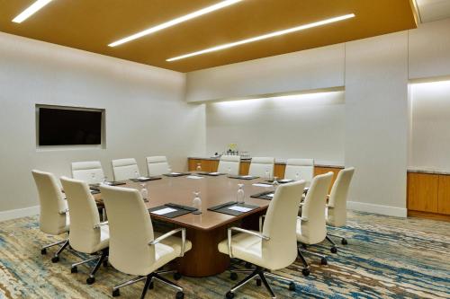 a conference room with a long table and chairs at The Westin Denver International Airport in Denver