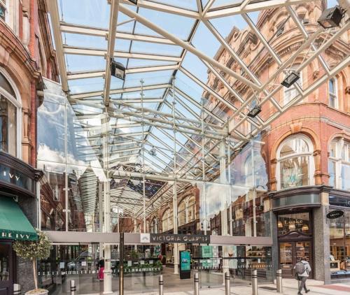 a large building with a glass ceiling in a mall at Pass the Keys Shoppers Oasis - Heart of Leeds City Centre in Leeds