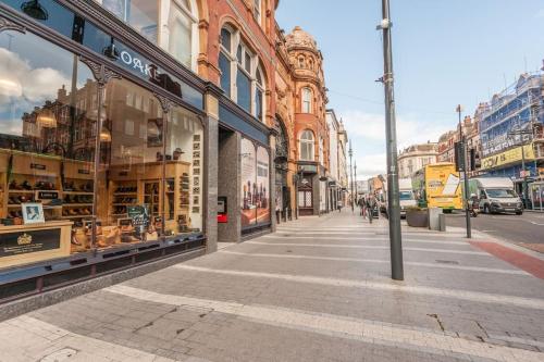 a city street with a store window on a street at Pass the Keys Shoppers Oasis - Heart of Leeds City Centre in Leeds