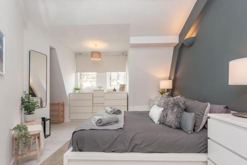 a bedroom with a bed with pillows on it at Pass the Keys Shoppers Oasis - Heart of Leeds City Centre in Leeds
