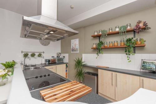 a kitchen with a sink and a stove top oven at Pass the Keys Shoppers Oasis - Heart of Leeds City Centre in Leeds