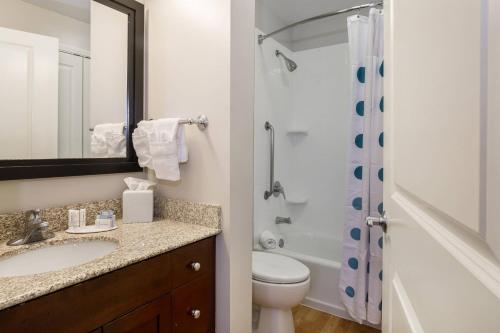 a bathroom with a sink and a toilet and a shower at TownePlace Suites by Marriott Boise Downtown/University in Boise