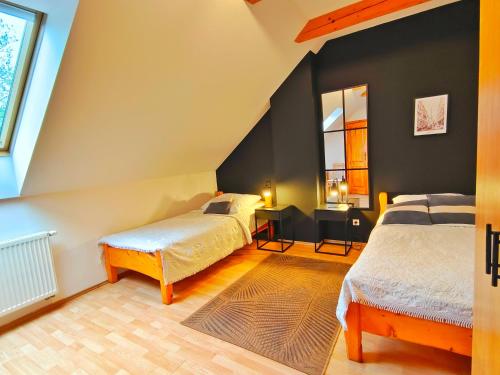 Postel nebo postele na pokoji v ubytování Karczma Maciejówka