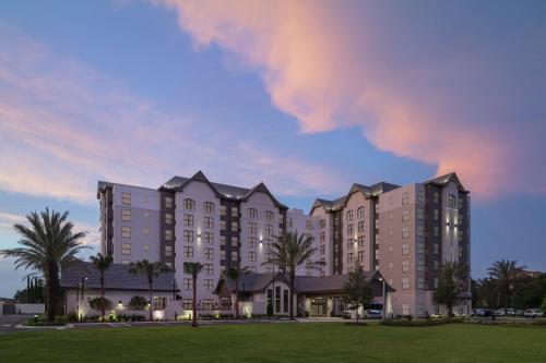 a rendering of a hotel at dusk at Residence Inn By Marriott Jacksonville-Mayo Clinic Area in Jacksonville