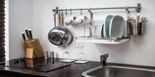 a kitchen with a sink and a counter with utensils at Vive Zen Queen Room in Miami