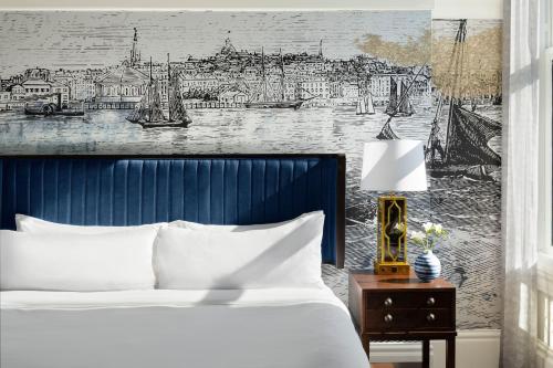 a bedroom with a bed and a drawing of a city at Marriott Vacation Club® at Custom House, Boston   in Boston