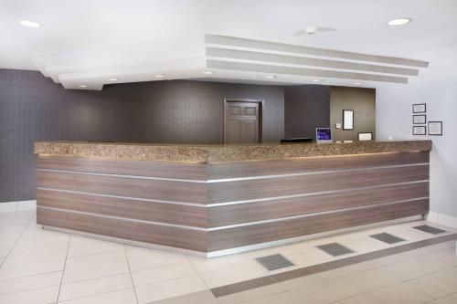 a lobby with a reception counter in a building at Residence Inn Denver Downtown in Denver