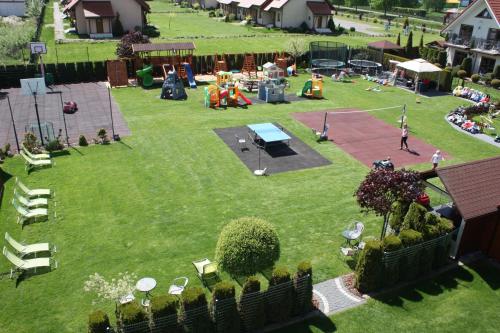 an aerial view of a park with a playground at Willa Klif in Rowy